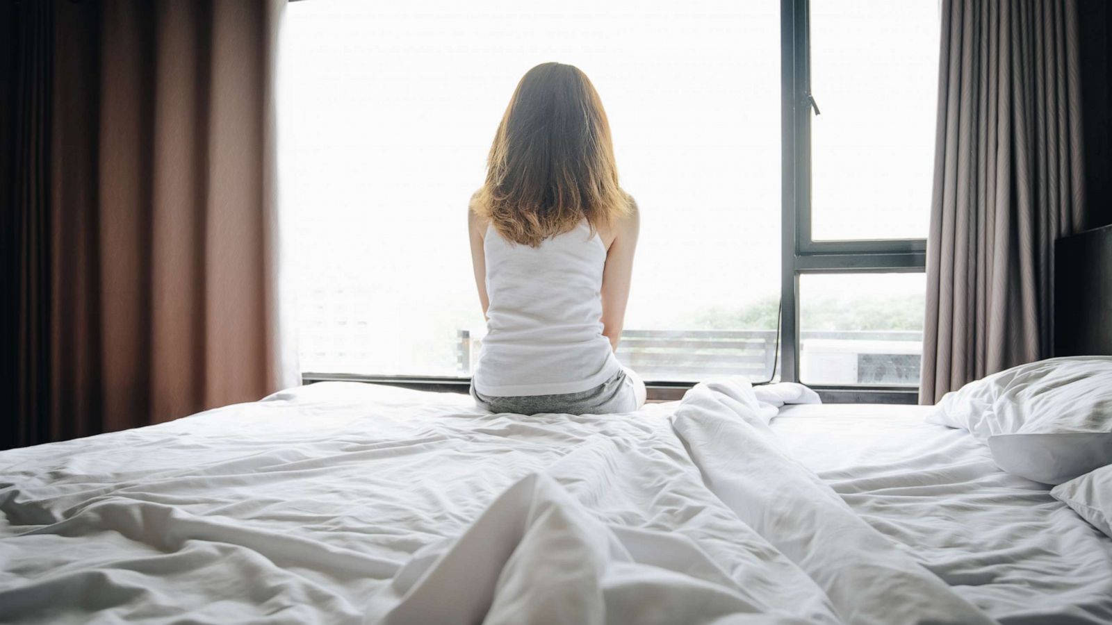 PHOTO: A young girl sits on a bed in this undated stock photo.