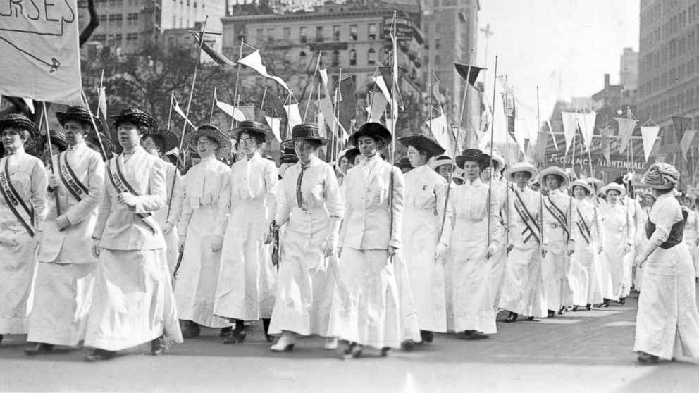 PHOTO: Nurses wearing white Edwardian clothing and sashes reading, "Votes for Women," demonstrate in New York in 1913.