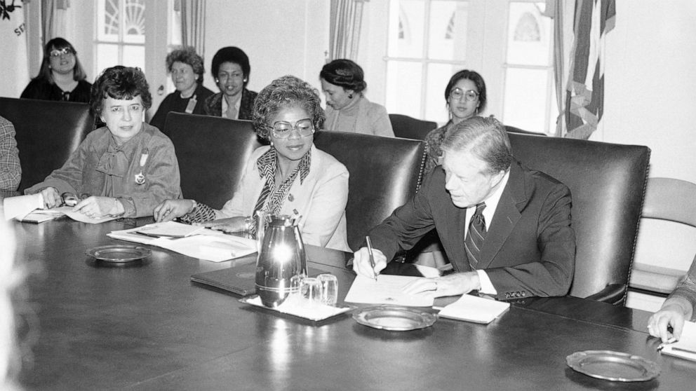 PHOTO: President Jimmy Carter signs document proclaiming March 2-8 "National Women's History Week" at the White House, Feb. 28, 1980. 