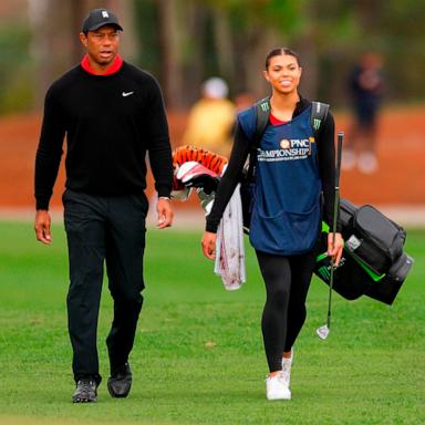 PHOTO: Tiger Woods of the United States and daughter and caddie, Sam Woods, walk on the fifth hole during the final round of the PNC Championship at The Ritz-Carlton Golf Club on December 17, 2023 in Orlando, Florida.