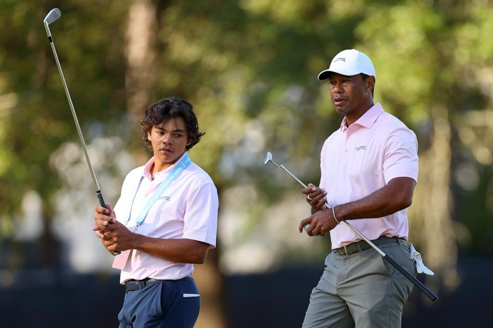 PHOTO: Tiger Woods and his son, Charlie Woods, look on from the second hole during a practice round prior to the U.S. Open at Pinehurst Resort on June 11, 2024 in Pinehurst, N.C.