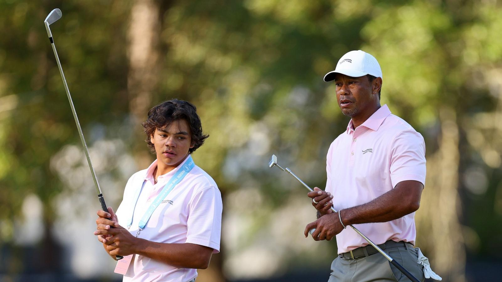 PHOTO: Tiger Woods and his son, Charlie Woods, look on from the second hole during a practice round prior to the U.S. Open at Pinehurst Resort on June 11, 2024 in Pinehurst, N.C.