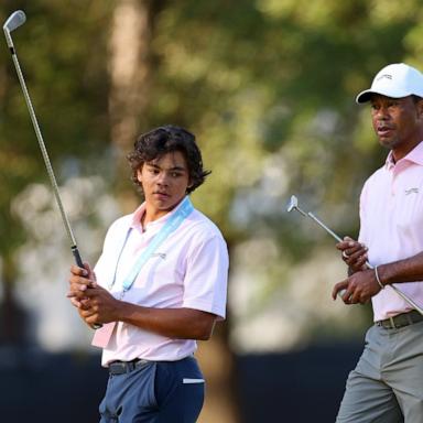 PHOTO: Tiger Woods and his son, Charlie Woods, look on from the second hole during a practice round prior to the U.S. Open at Pinehurst Resort on June 11, 2024 in Pinehurst, N.C.