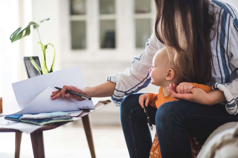 PHOTO: An undated stock photo depicts a working mother with her young child.