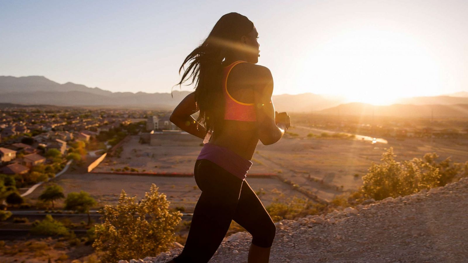 PHOTO: In an undated stock photo, a woman is seen running along a road.