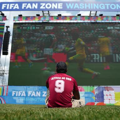 PHOTO: A FIFA World Cup 2026 fan watches a match in a fan zone in Washington D.C., June 11, 2026.