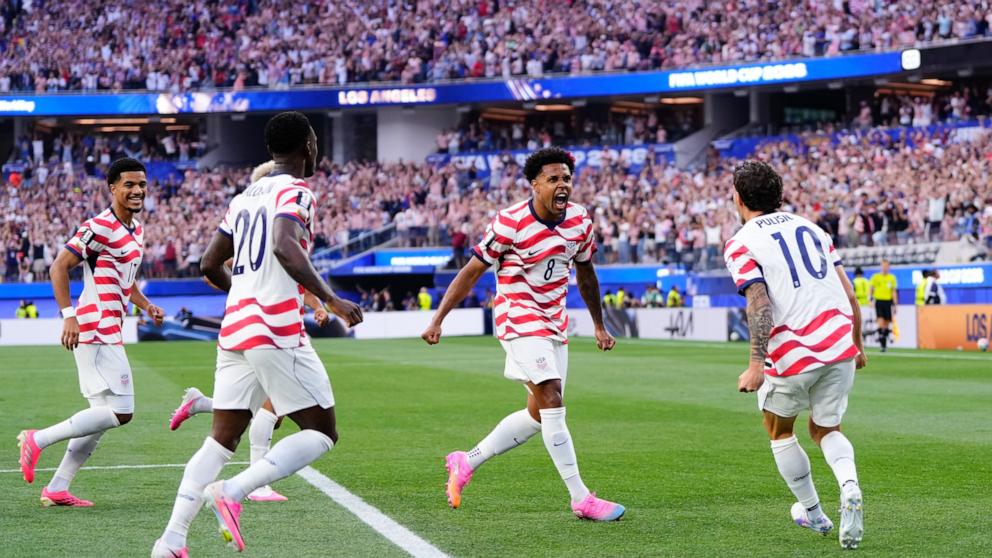 PHOTO: Weston Mckennie and Christian Pulisic celebrate an own goal scored by Damian Bobadilla of Paraguay during the FIFA World Cup 2026 Group D match between USA and Paraguay at Los Angeles Stadium on June 12, 2026 in Inglewood, California.