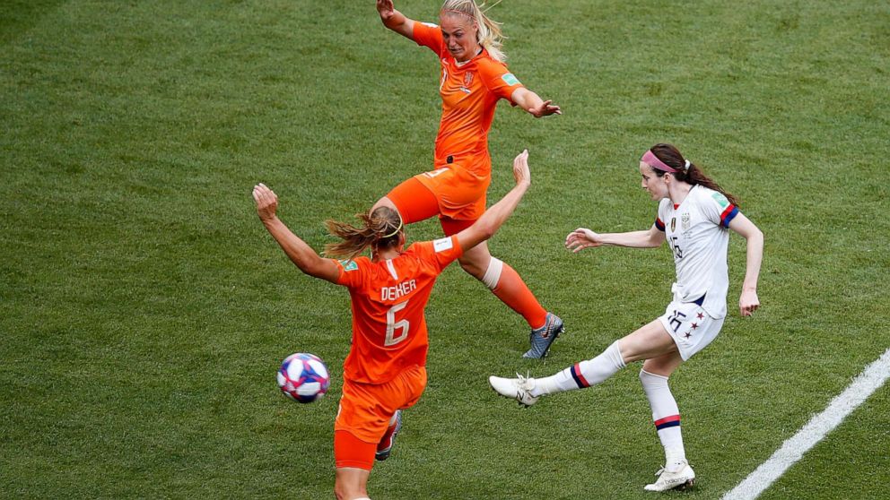 PHOTO: United States' Rose Lavelle, right, shoots to score her side's second goal during the Women's World Cup final soccer match between US and The Netherlands at the Stade de Lyon in Decines, France, July 7, 2019. 