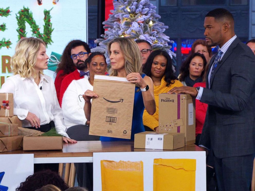 PHOTO: ABC News' Becky Worley shows Amazon's recyclable shipping envelope to Sara Haines and Michael Strahan on "Good Morning America" on Dec. 10, 2019.