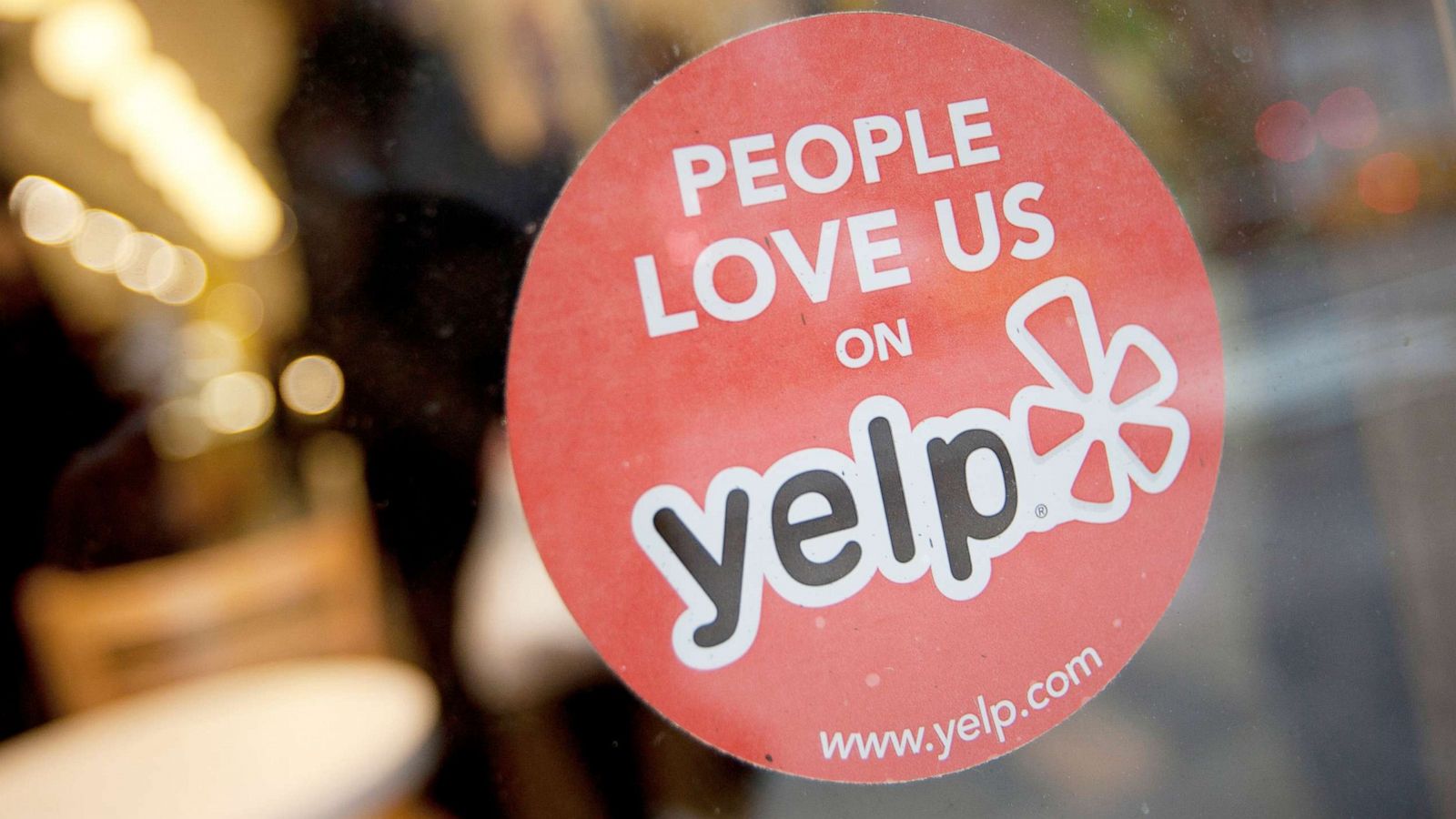 PHOTO: The Yelp logo is displayed on a sticker in the window of a restaurant in New York, March 1, 2012.