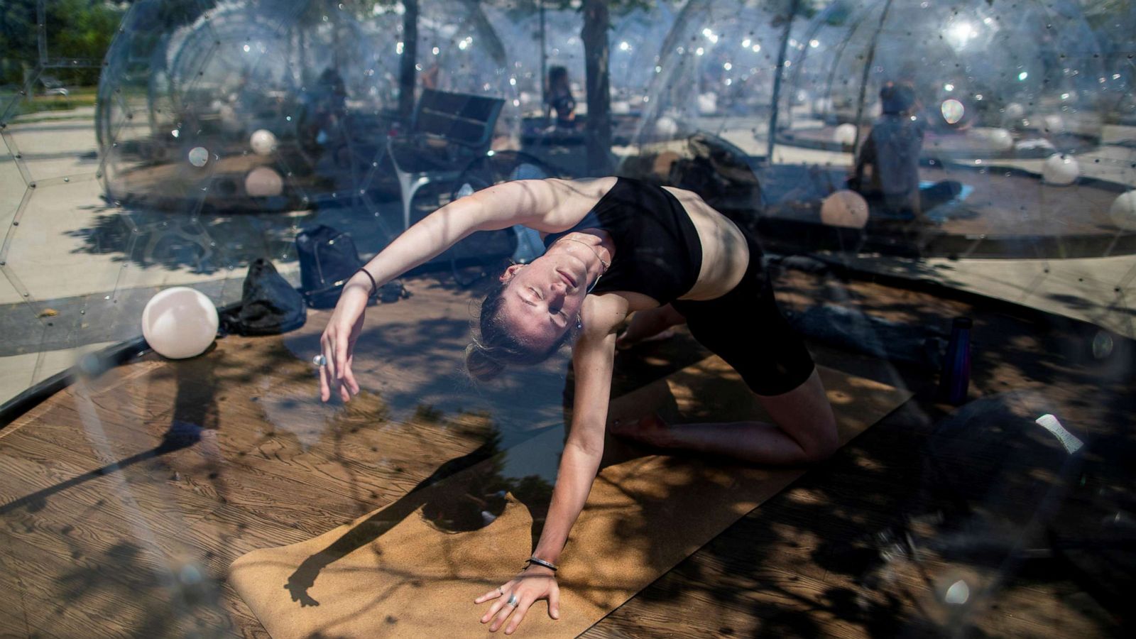 PHOTO: Holland Philpott participates in an outdoor yoga class by LMNTS Outdoor Studio, in a dome to facilitate social distancing and proper protocols to prevent the spread of coronavirus disease, in Toronto, June 21, 2020.