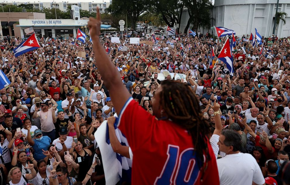 PHOTO: Singer Yotuel Romero addresses protesters gathered in front of the Versailles restaurant as they show support for the people in Cuba who have taken to the streets there to protest on July 11, 2021, in Miami.