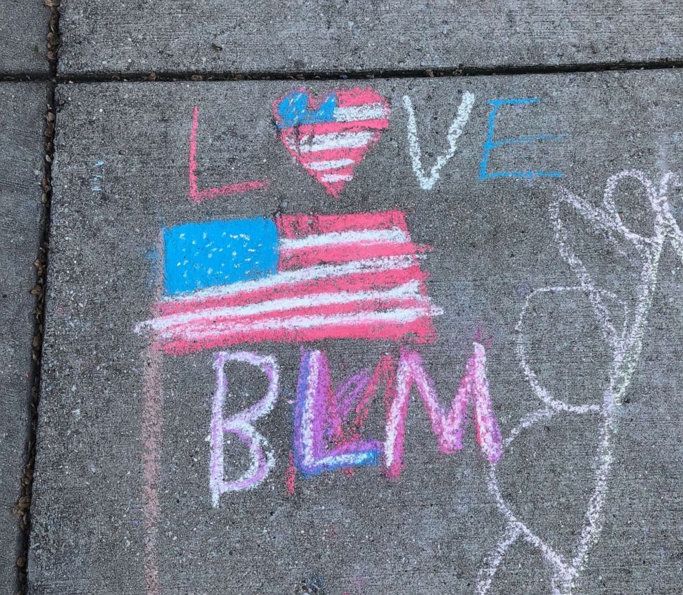 PHOTO: Aiden Kelley, 9, marched and made chalk drawings asked his neighbors to treat each other with respect and kindness in support of the Black Lives Matter movement outside his Chicago home in an undated handout photo.