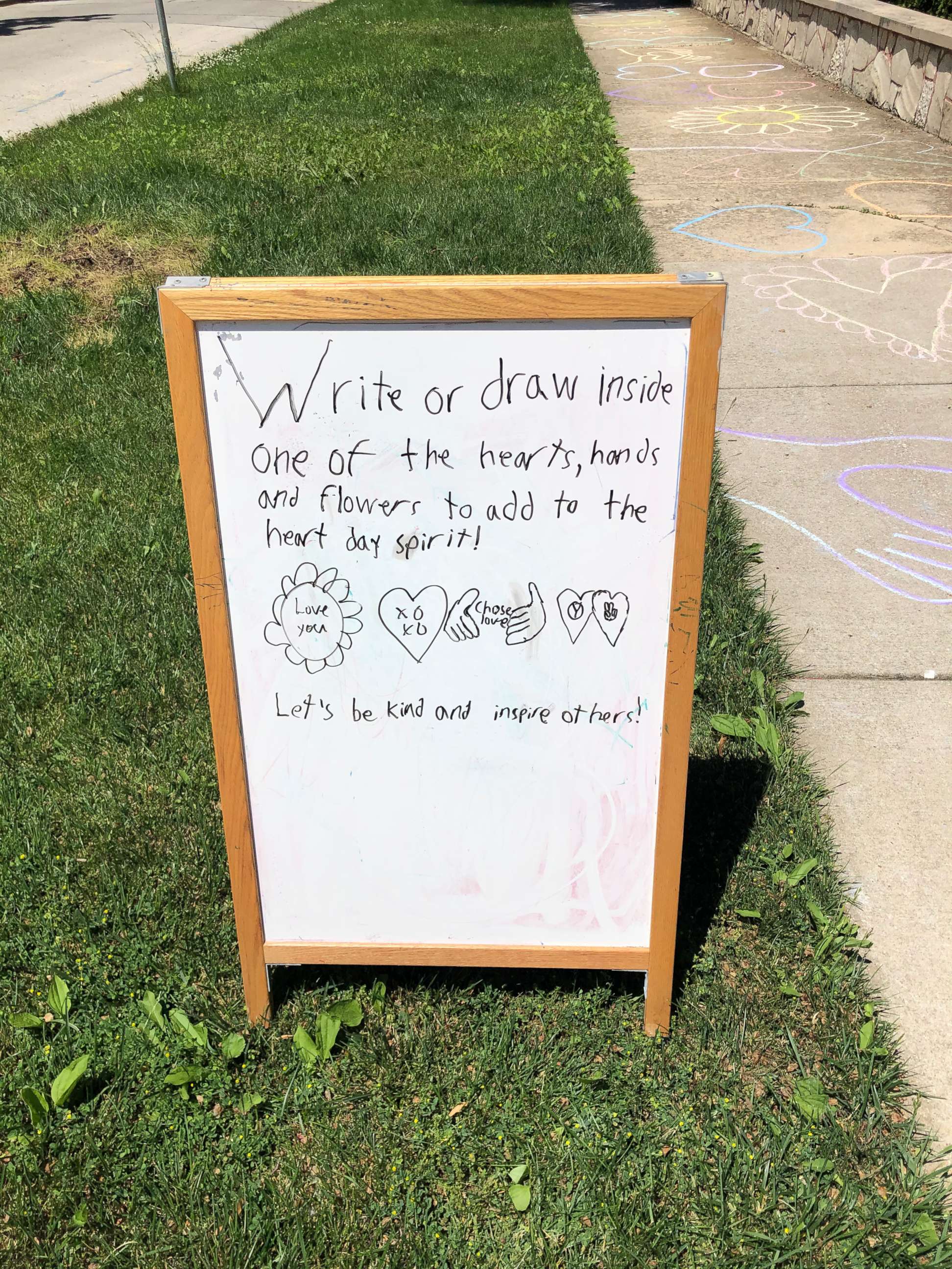 PHOTO: Aiden Kelley, 9, marched and made chalk drawings asked his neighbors to treat each other with respect and kindness in support of the Black Lives Matter movement outside his Chicago home in an undated handout photo.