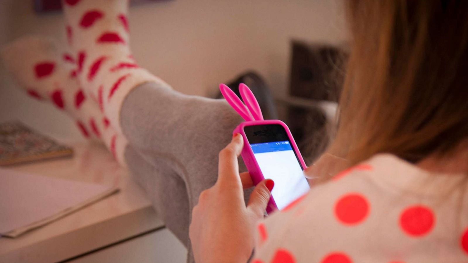 PHOTO: A young girl is seen using a smartphone in this stock image.