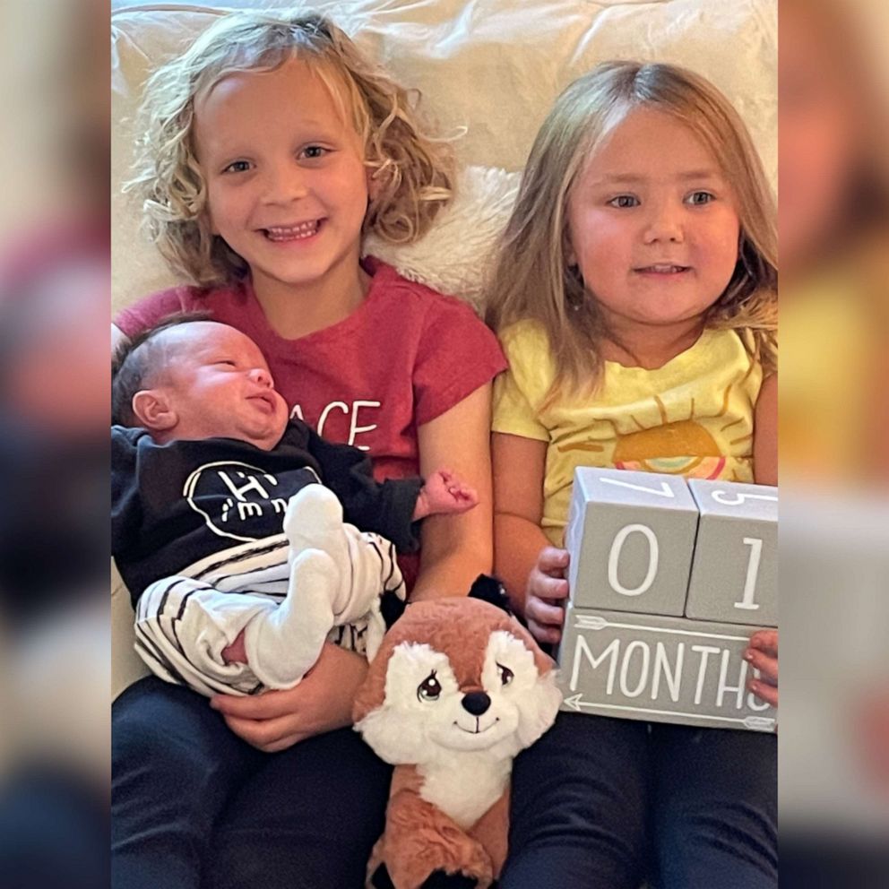 PHOTO: Zach and Autumn Carver's two daughters, Sadie and Harlow, pose with their newborn brother, Huxley.