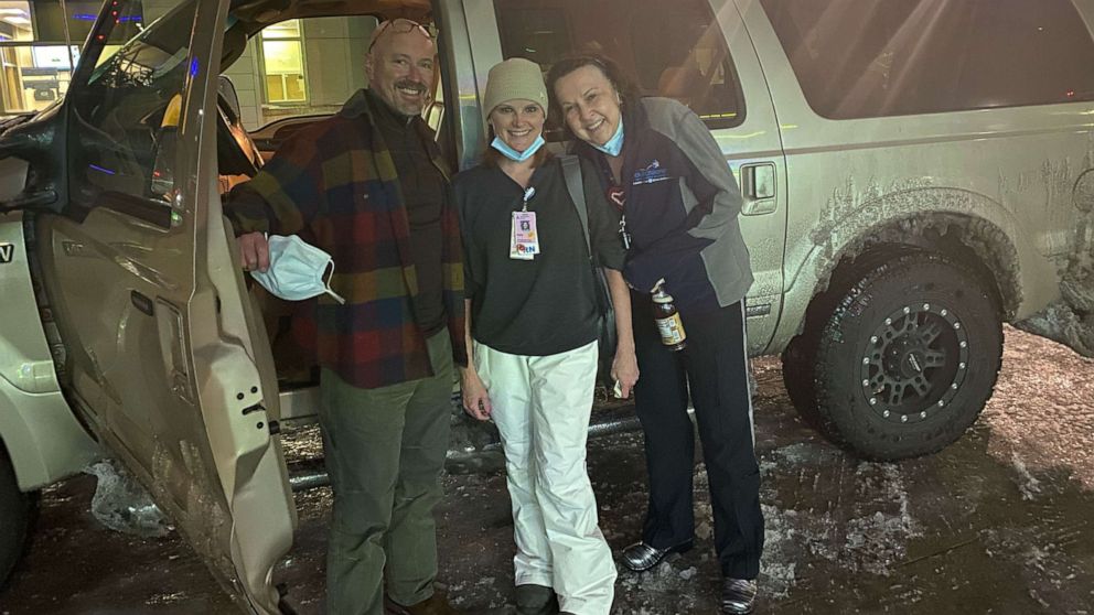 PHOTO: Dr. John Loyd, far left, chief of neonatology at Dell Children's, poses with the two nurses he traveled with in a snowstorm to help save the life of a premature baby.