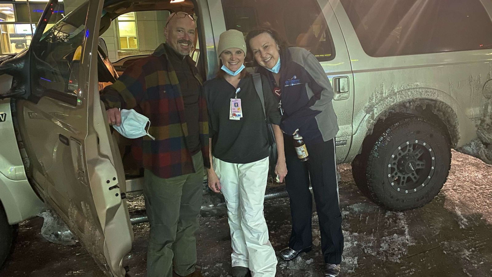 PHOTO: Dr. John Loyd, far left, chief of neonatology at Dell Children's, poses with the two nurses he traveled with in a snowstorm to help save the life of a premature baby.