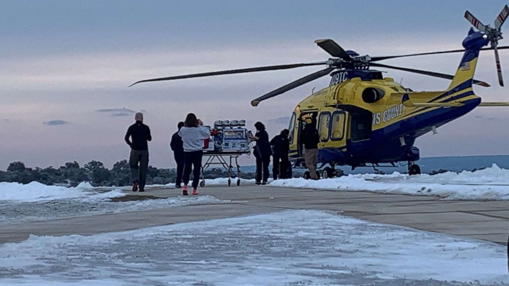 PHOTO: Healthcare providers transport baby Zaylynn onto a medical helicopter.