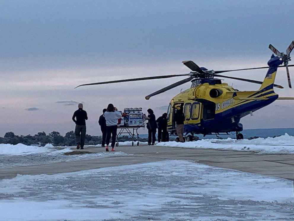 PHOTO: Healthcare providers transport baby Zaylynn onto a medical helicopter.