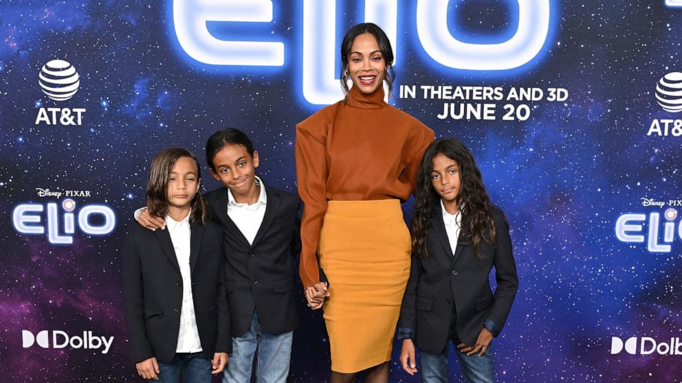 PHOTO: Zoe Saldana and her children twins Cy Arido Perego and Bowie Ezio Perego with Zen Anton Hilario Perego attend the world premiere of Disney and Pixar's "Elio" at the El Capitan Theatre in Los Angeles on June 10, 2025.