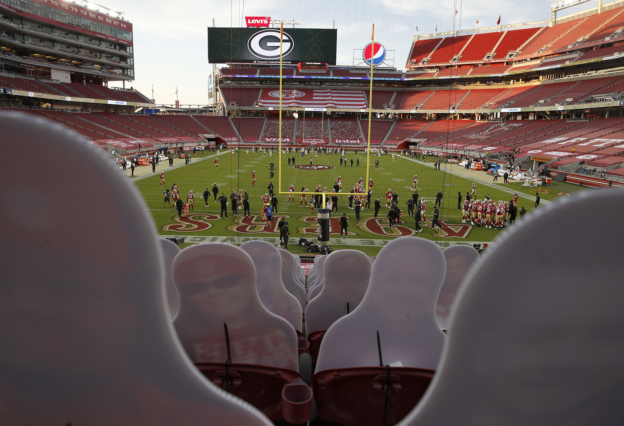 PHOTO: Fan cutouts are seen in the stands as the San Francisco 49ers warm up before their NFL game against the Green Bay Packers at Levi's Stadium in Santa Clara, Calif., Nov. 5, 2020. 