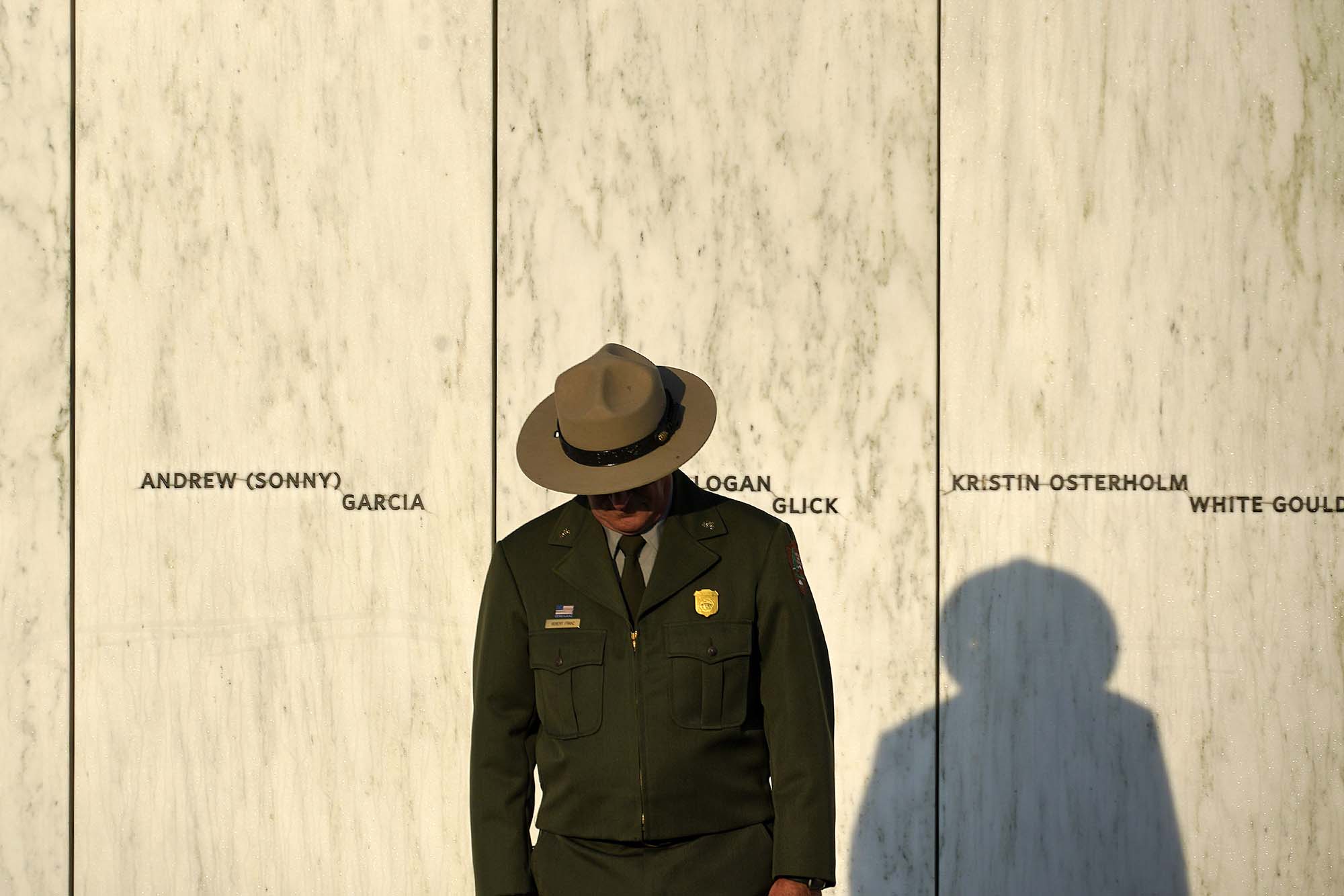 PHOTO: A National Park Service ranger stands in front of the Wall of Names at the Flight 93 National Memorial in Shanksville, Pa. before a Service of Remembrance, Sept. 11, 2021.