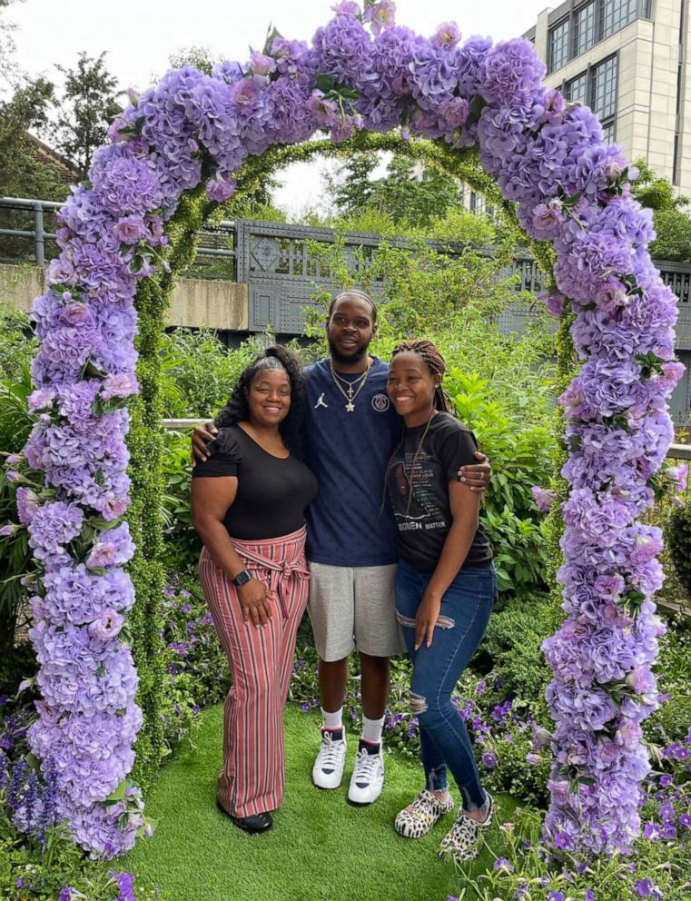 PHOTO: Breonna Taylor's sister, Ju'Niyah Palmer, Kenneth Walker and Tamika Palmer stand in mourning in a garden honoring  Breonna Taylor and anyone else who needs to grieve.