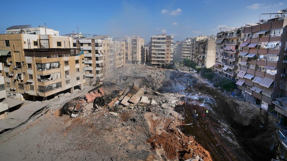 PHOTO: People gather at the site of the assassination of Hezbollah leader Hassan Nasrallah in Beirut's southern suburbs, Sept. 29, 2024. 