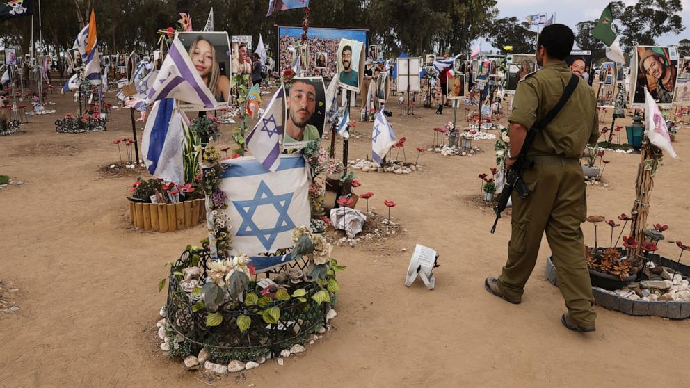 PHOTO: An Israeli soldier visits an installation honoring those who were killed and kidnapped during the October 7 attacks by Palestinian militants, at the site of the festival near Kibbutz Reim in southern Israel, Oct. 6, 2024. 