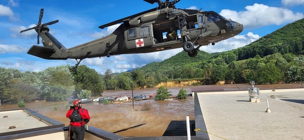 PHOTO: Rescue helicopters land on the roof of Unicoi Hospital in Erwin, Tenn., Sept. 27, 2024.