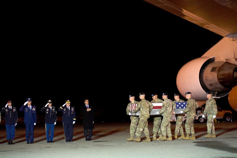 PHOTO: Armed forces carry a transfer case covered with an American flag during a dignified transfer for fallen service member Sergeant Leandro A.S. Jasso, Nov. 27, 2018, in Dover, Delaware.