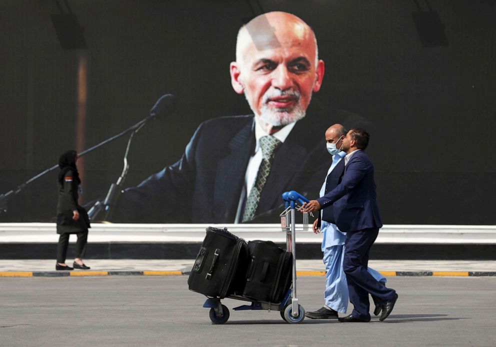 PHOTO: Passengers walk to the departures terminal of Hamid Karzai International Airport in Kabul, Afghanistan,  Aug. 14, 2021. 