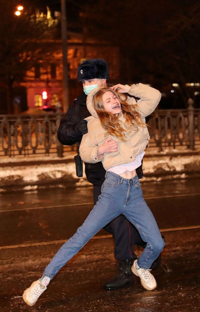 PHOTO: A law enforcement officer detains a woman during a rally in support of jailed Russian opposition leader Alexey Navalny in Moscow, Jan. 23, 2021.