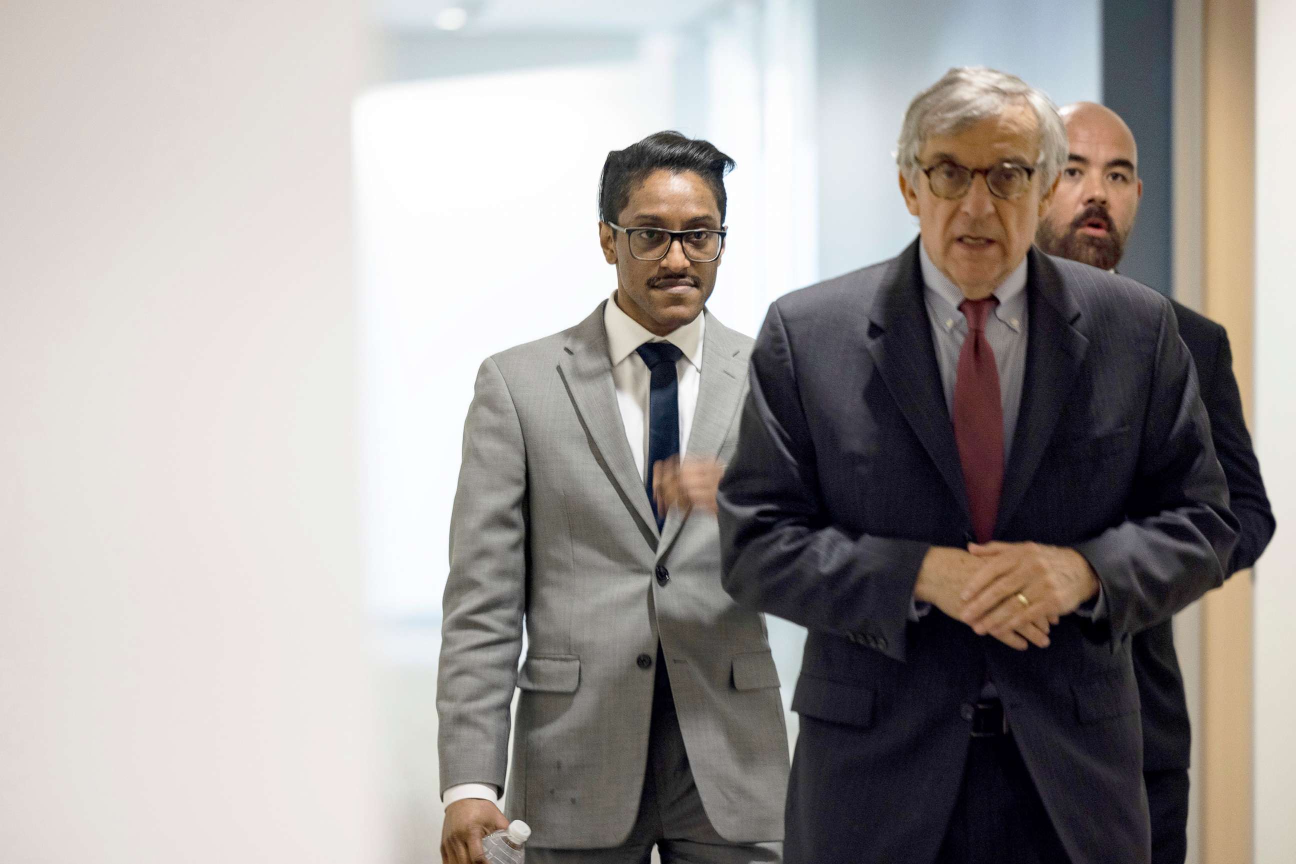 PHOTO: Stop the Steal organizer Ali Alexander returns to a conference room for a deposition meeting on Capitol Hill with the House select committee investigating the January 6th attack, Washington, Dec. 09, 2021.