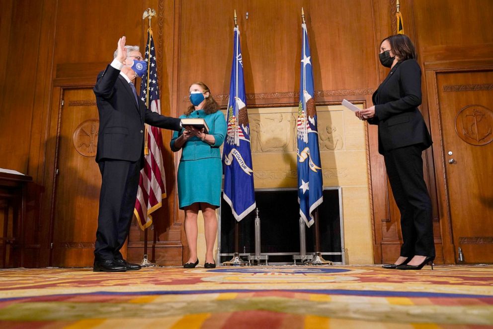 PHOTO: Vice President Kamala Harris ceremonially administers the oath of office to Attorney general Merrick Garland as his wife Lynn Garland looks on at center at the Department of Justice in Washington, March 11, 2021.