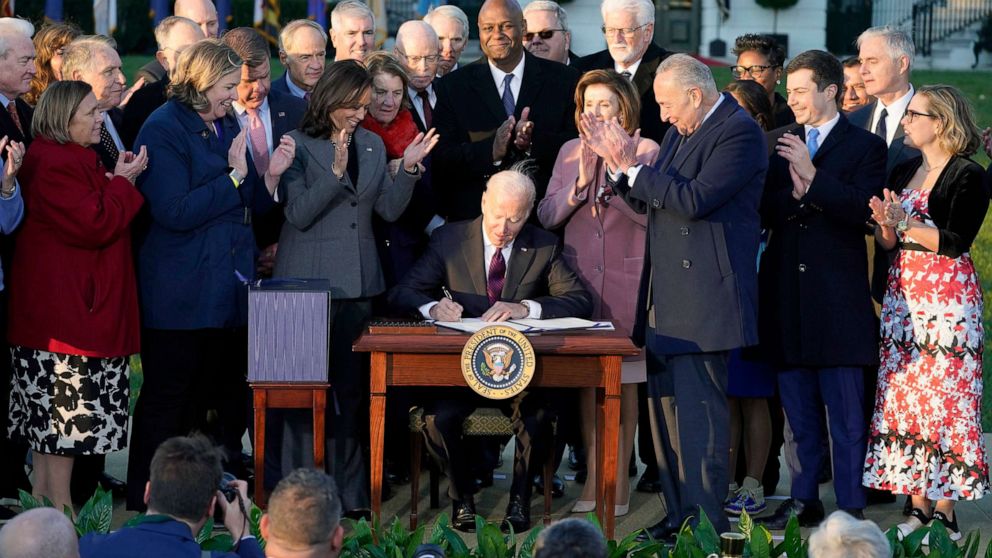 Biden signs bipartisan infrastructure bill with Republicans on hand to ...