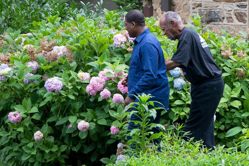 PHOTO: Bill Cosby leaves his home alongside spokesperson Andrew Wyatt, Elkins Park, Pa. July 1, 2021.