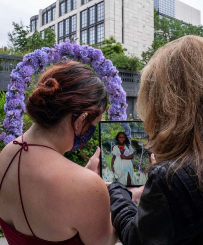 PHOTO: People use the Breonna's app to overlay her virtual memorial with her physical memorial in the Miami garden.