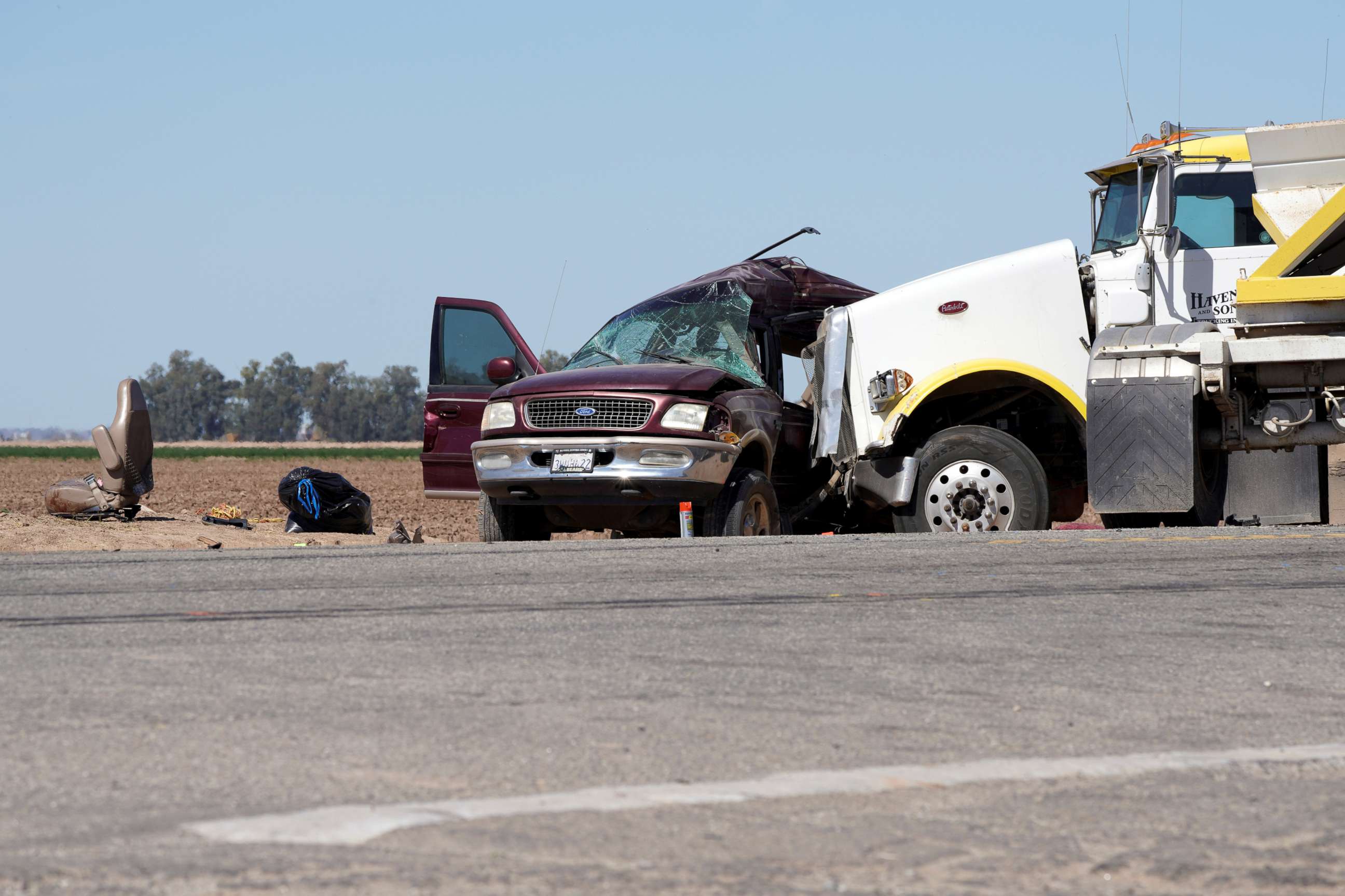 PHOTO: The scene of a collision between a sport utility vehicle and a tractor-trailer truck is seen near Holtville, Calif., March 2, 2021. 