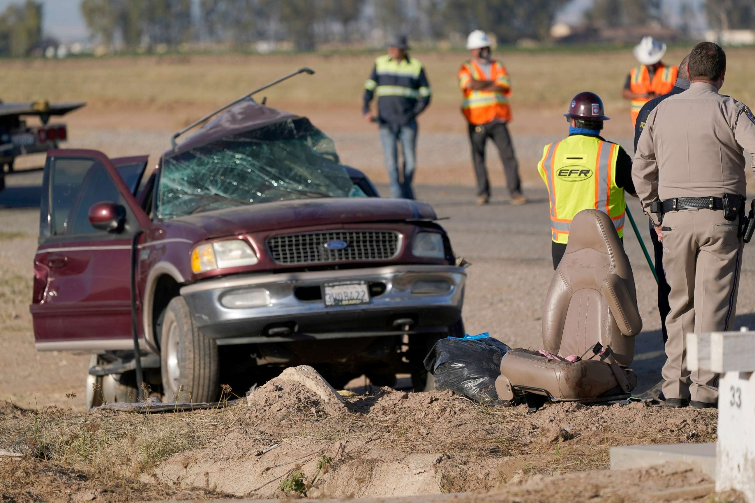 PHOTO: Law enforcement officers sort evidence and debris at the scene of a deadly crash in Holtville, Calif., March 2, 2021.