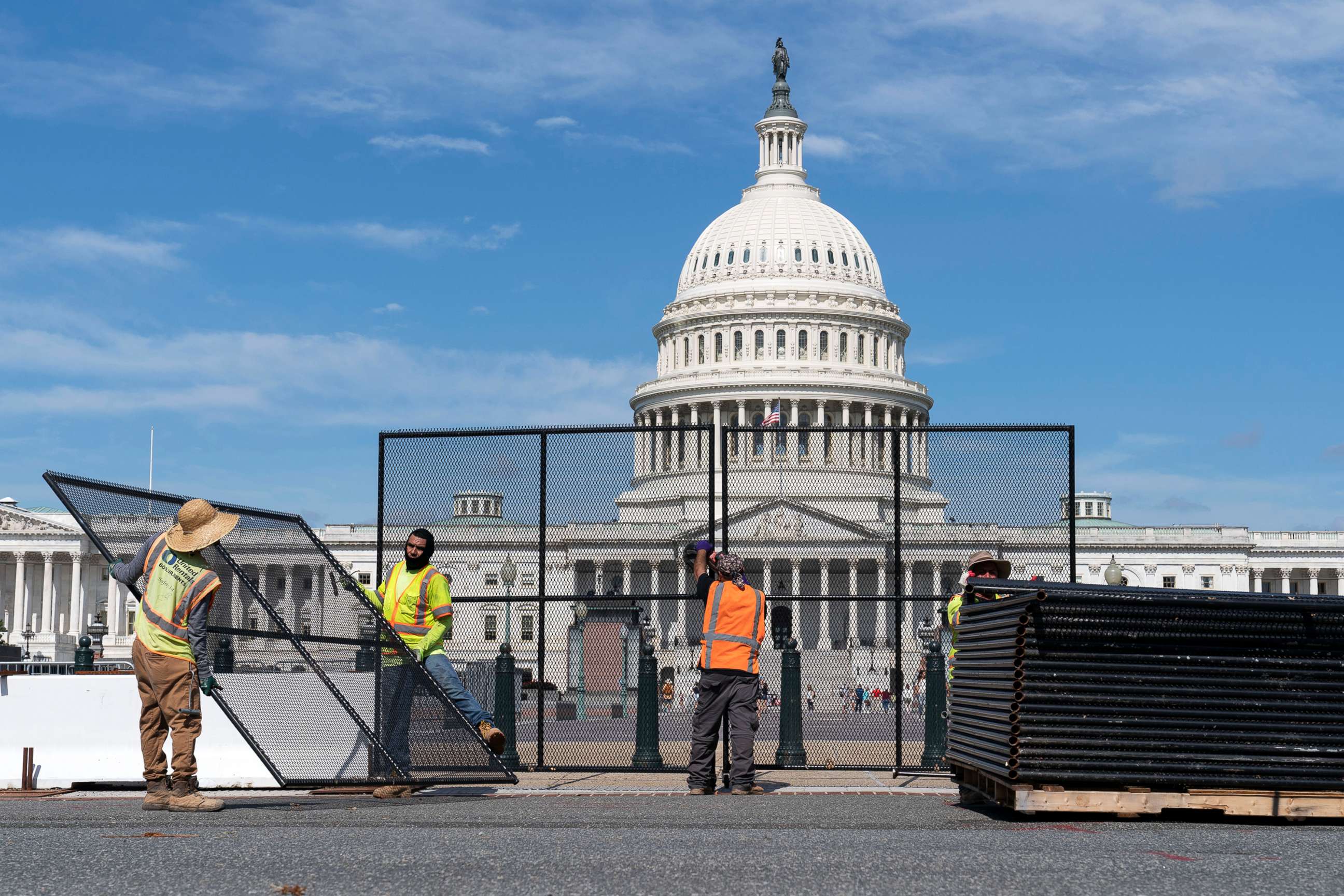PHOTO: Workers remove the fence surrounding the Capitol building, July 10, 2021.
