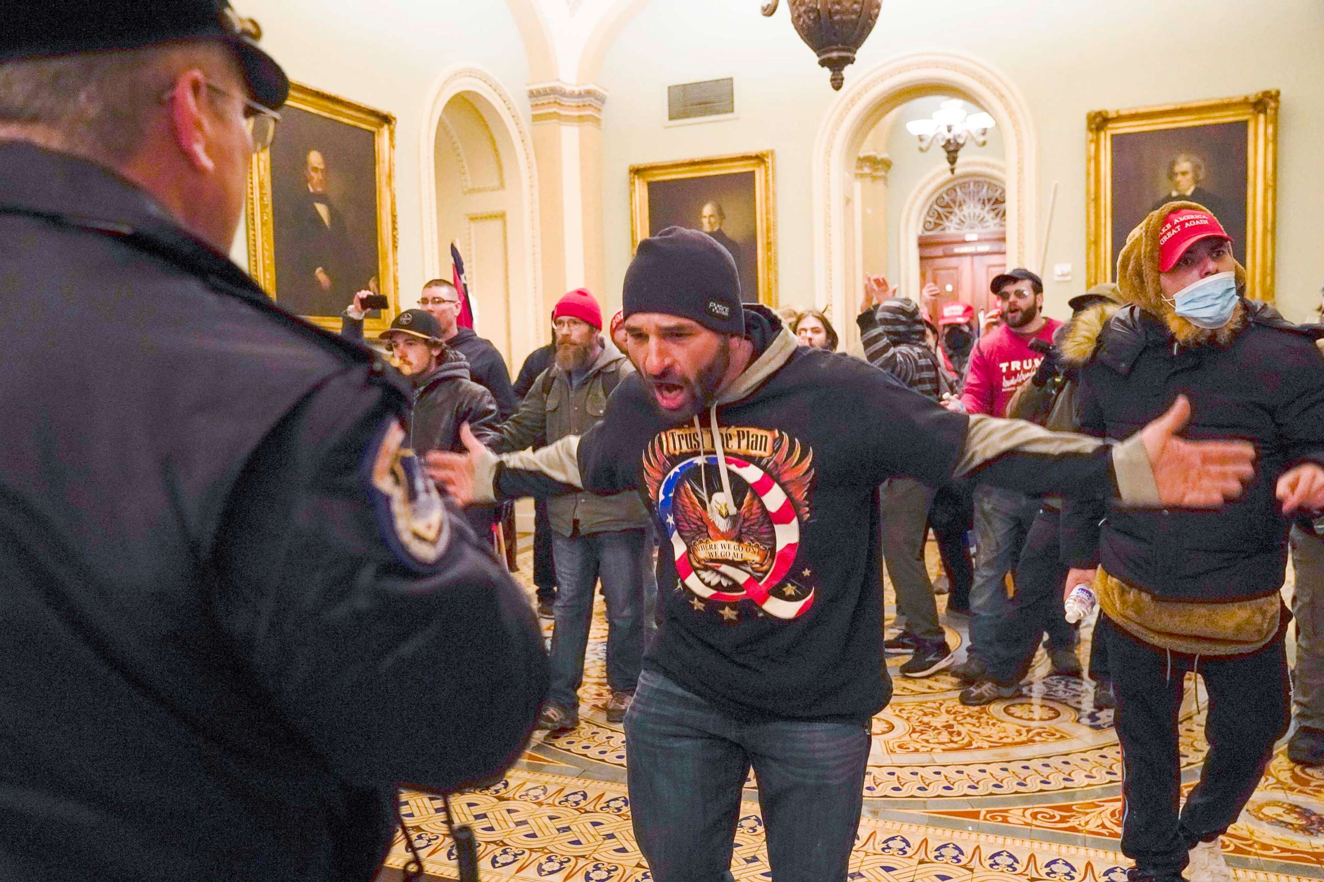 PHOTO: Douglas Jensen from Des Moines, Iowa and other protesters confront U.S. Capitol Police in the hallway outside of the Senate chamber in Washington, Jan. 6, 2021.