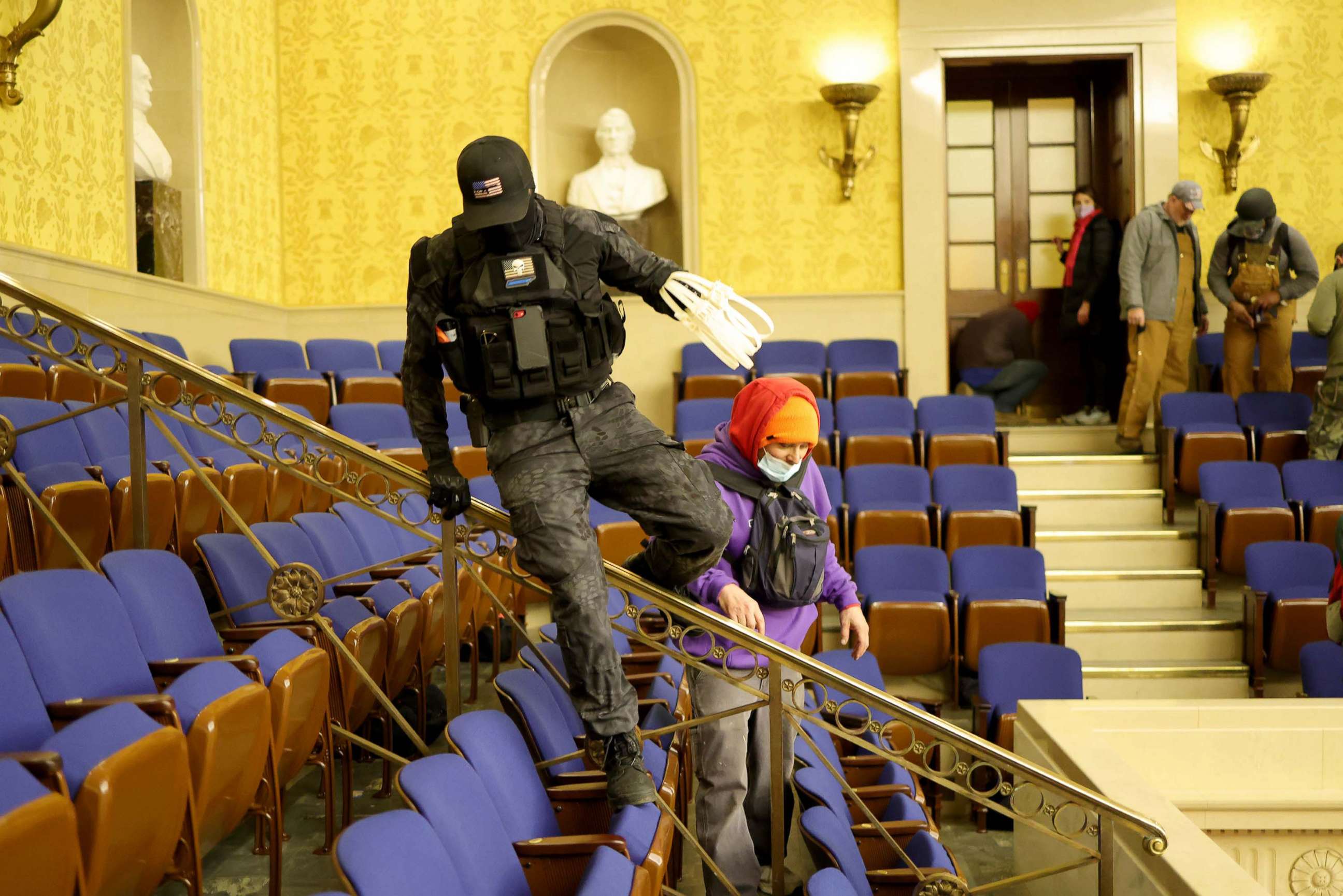 PHOTO: Protesters carring zip ties enter the Senate Chamber on in the Capitol in Washington, Jan. 6, 2021.