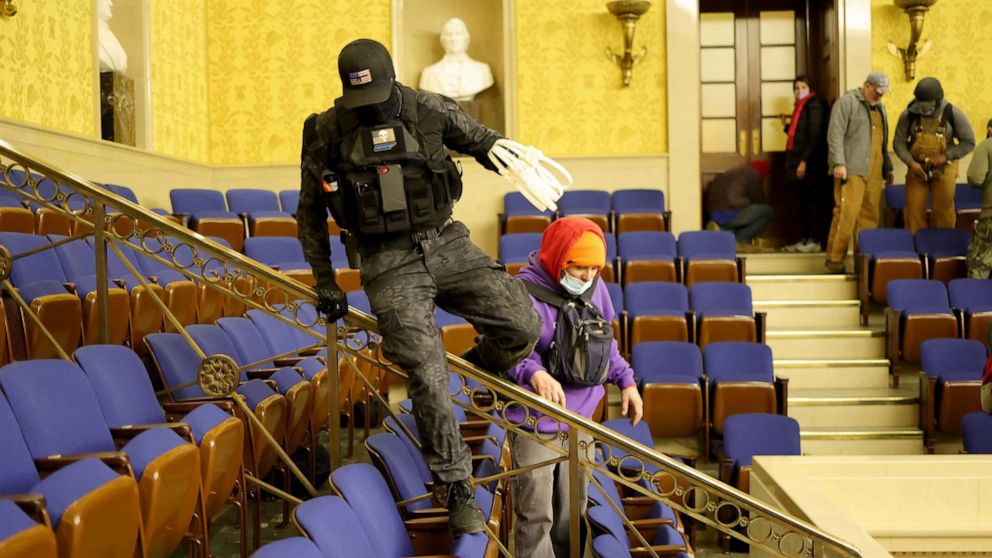 PHOTO: Protesters carring zip ties enter the Senate Chamber on in the Capitol in Washington, Jan. 6, 2021.