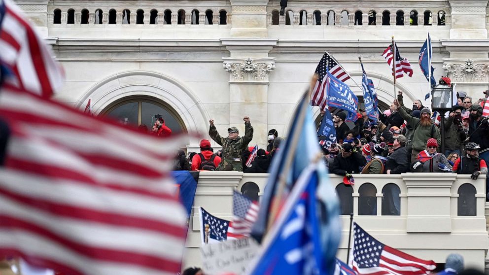 PHOTO: Supporters of President Donald Trump take over balconies and inauguration scaffolding at the United States Capitol on Wednesday Jan. 06, 2021.