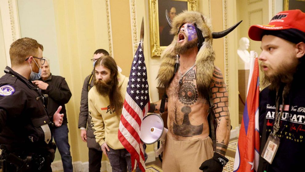 PHOTO: Protesters, including Jacob Anthony Chansley, a.k.a. Jake Angeli, of Arizona, confront Capitol Police after penetrating security at the U.S. Capitol Building on Jan. 06, 2021. 