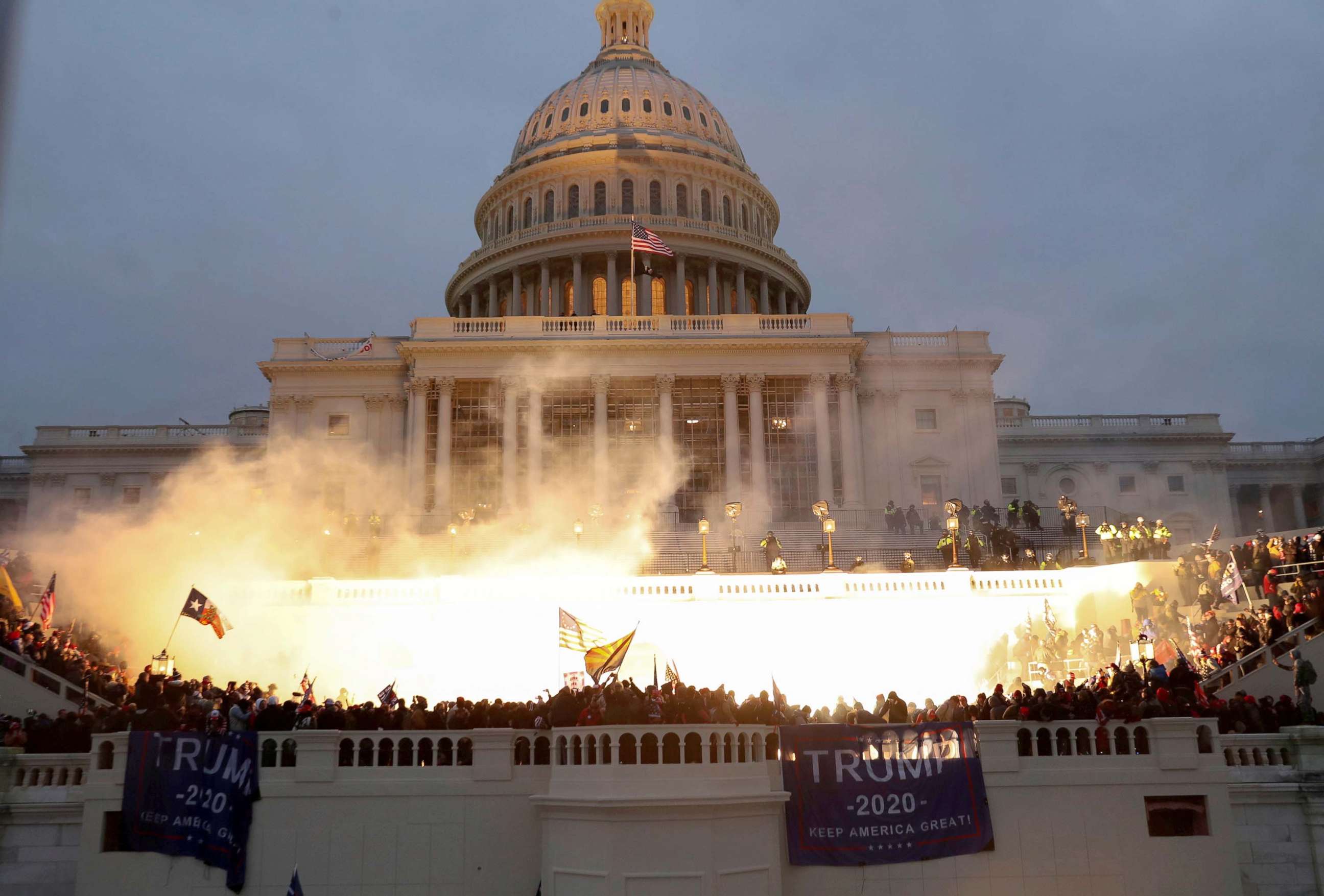 PHOTO: An explosion caused by a police munition is seen while supporters of U.S. President Donald Trump gather in front of the Capitol Building in Washington, Jan. 6, 2021. 