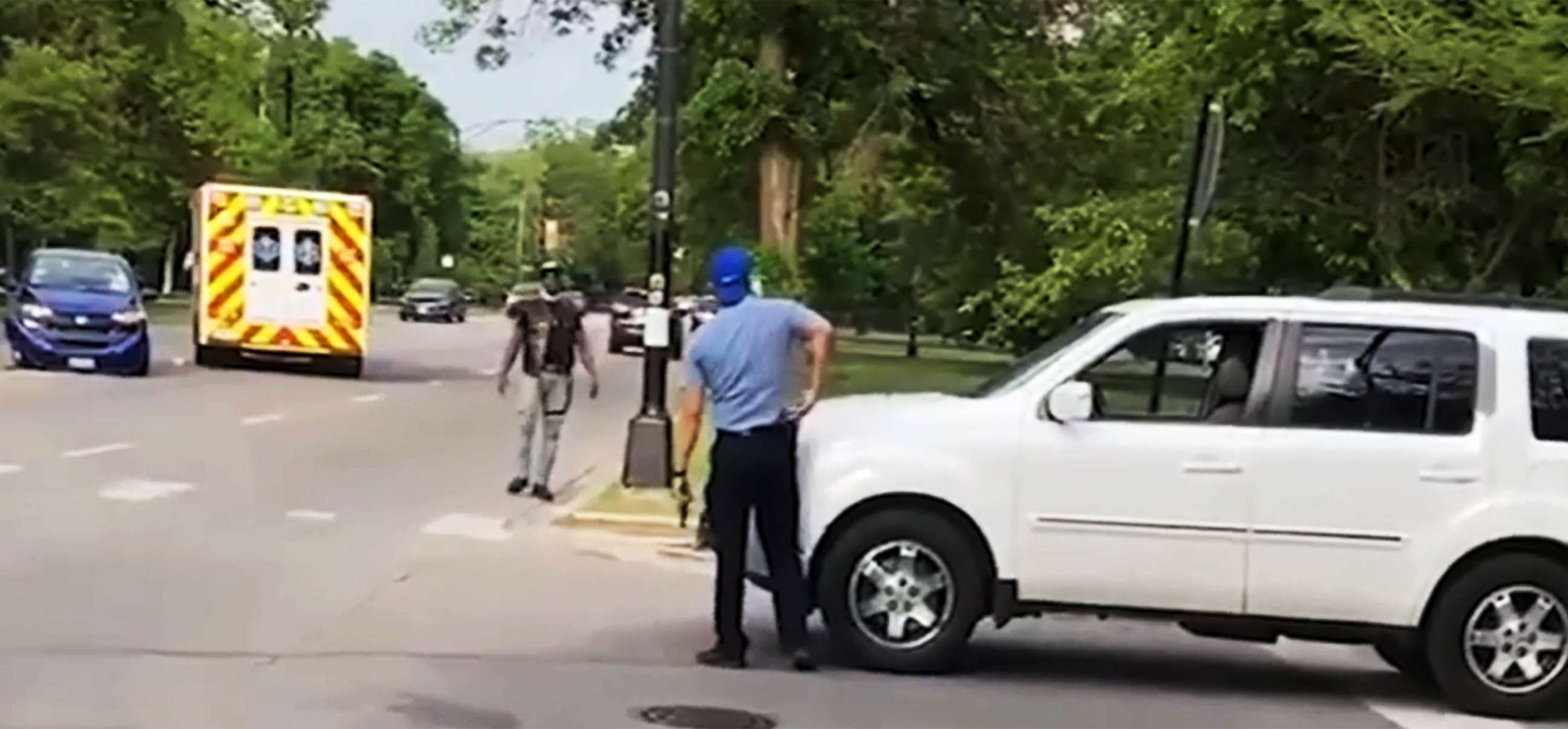 PHOTO: Video obtained by the ABC7/WLS-TV I team shows a man with a weapon in his hand, allegedly Chicago Police office Evan Solano, arguing with another driver.