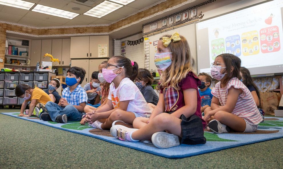 PHOTO: Students listen to their teacher during their first day of  transitional kindergarten at Tustin Ranch Elementary School in Tustin, Calif., Aug. 11, 2021.